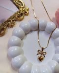 GOLDEN BOW HEART NECKLACE