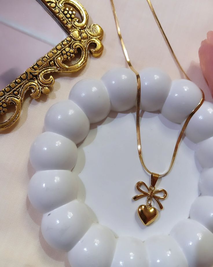 GOLDEN BOW HEART NECKLACE
